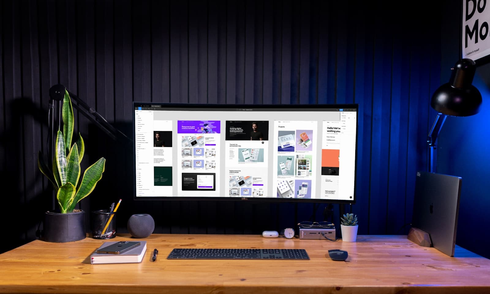 Designer workspace reviewing brand creative on screen